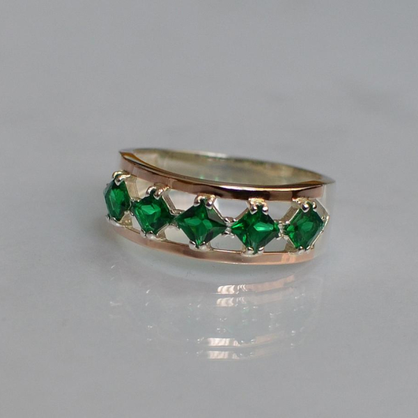 Срібна каблучка з золотими вставками