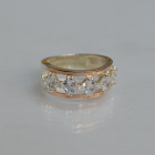 Срібна каблучка з золотими вставками