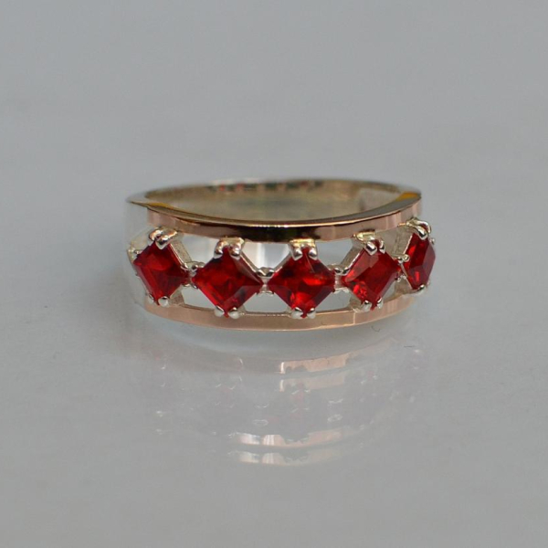 Срібна каблучка з золотими вставками