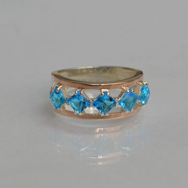 Срібна каблучка з золотими вставками