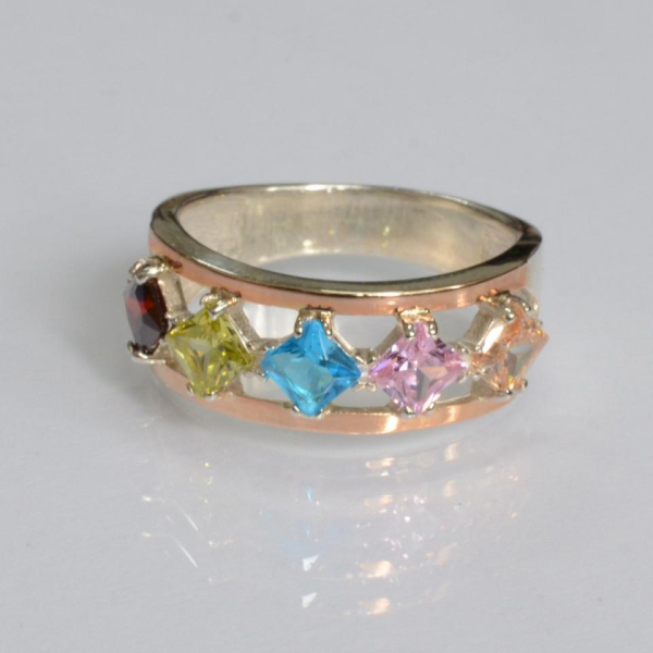 Срібна каблучка з золотими вставками