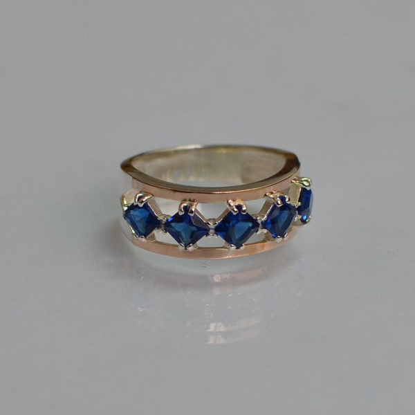 Срібна каблучка з золотими вставками