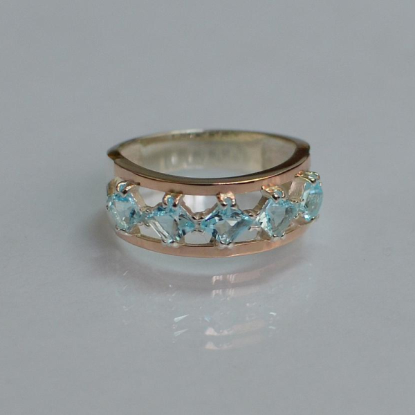 Срібна каблучка з золотими вставками