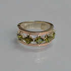 Срібна каблучка з золотими вставками