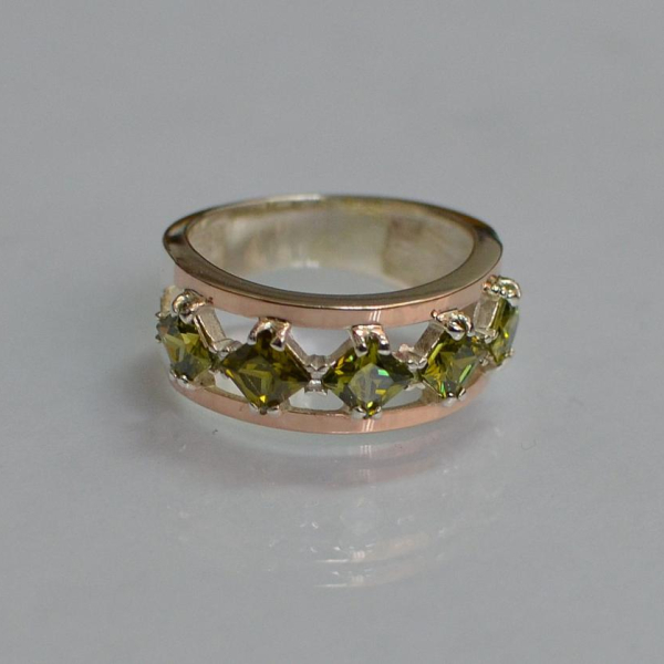 Срібна каблучка з золотими вставками