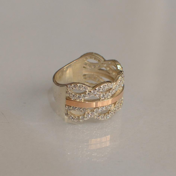 Срібна каблучка з золотими вставками