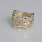 Срібна каблучка з золотими вставками