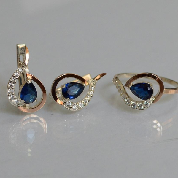 Срібний набір з золотими пластинами