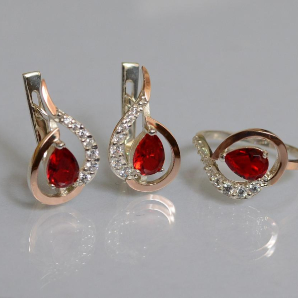 Срібний набір з золотими пластинами