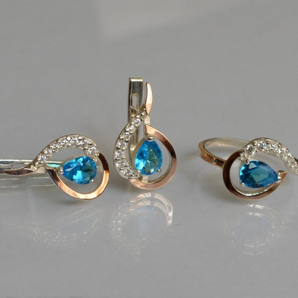 Срібний набір з золотими пластинами