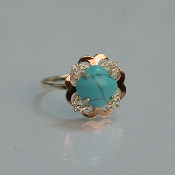 Срібна каблучка з золотими вставками