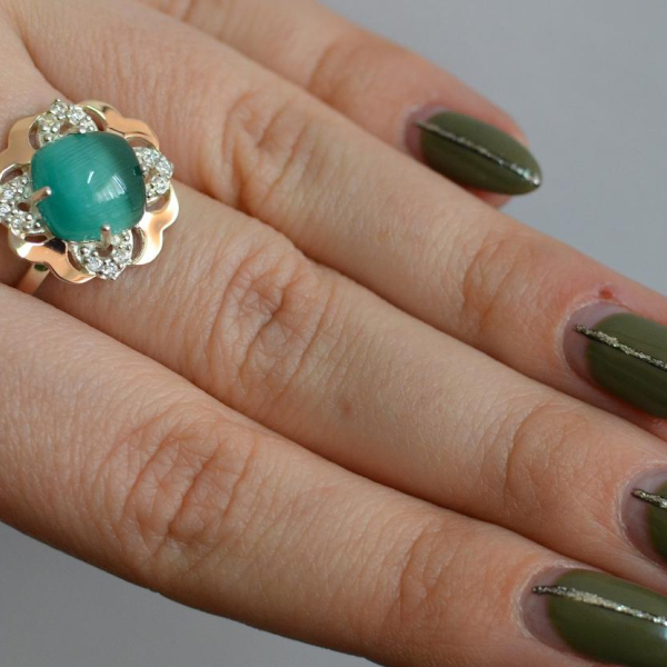 Срібна каблучка з золотими вставками