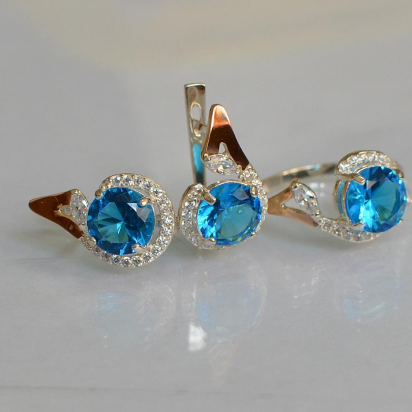 Срібний набір з золотими пластинами