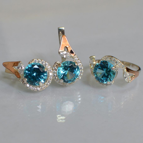 Срібний набір з золотими пластинами