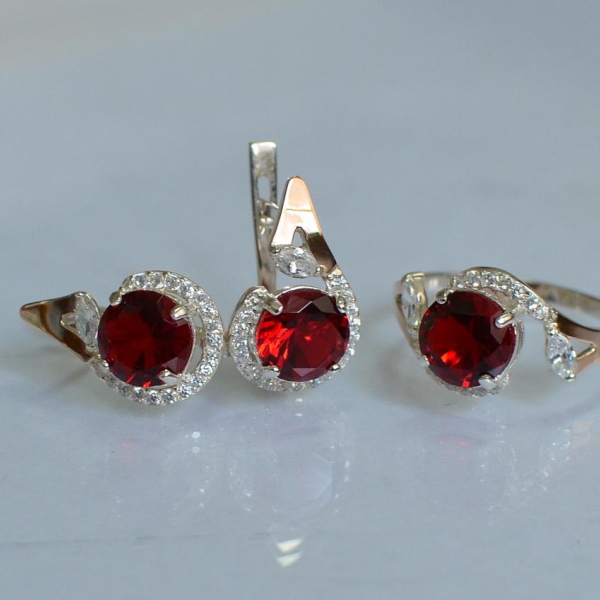 Срібний набір з золотими пластинами