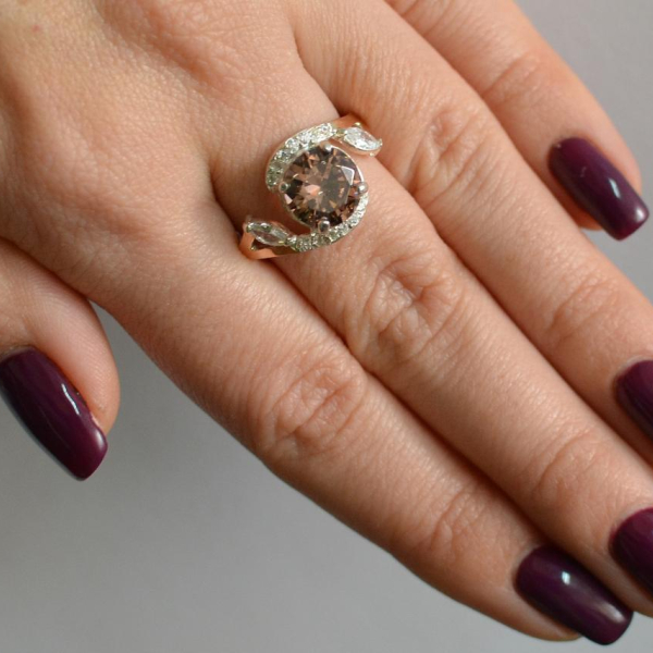 Срібна каблучка з золотими вставками