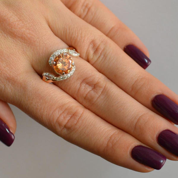 Срібна каблучка з золотими вставками