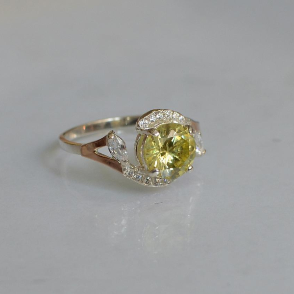 Срібна каблучка з золотими вставками