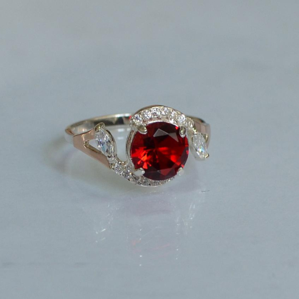 Срібна каблучка з золотими вставками