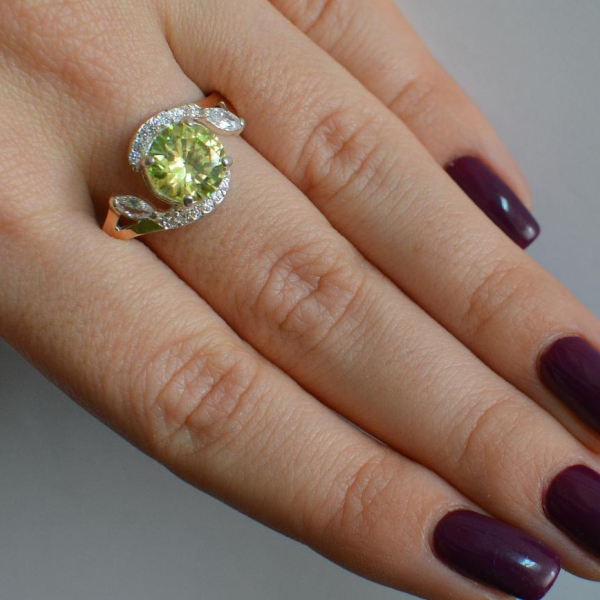 Срібна каблучка з золотими вставками