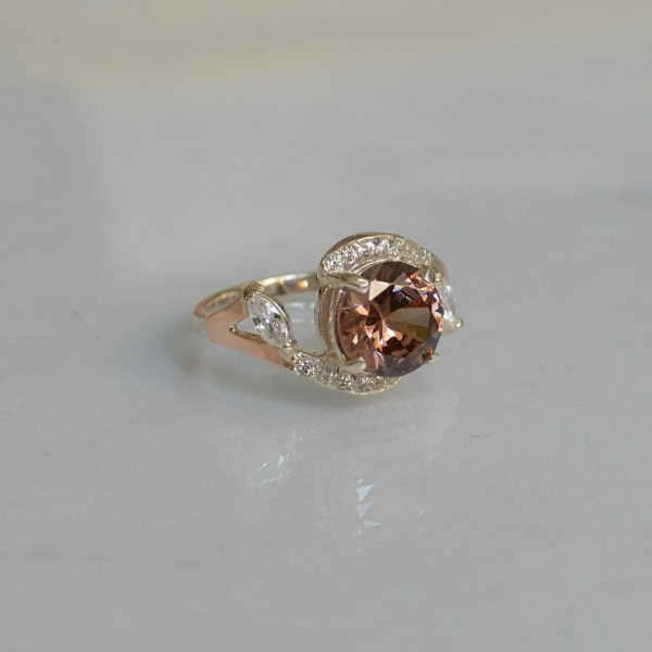 Срібна каблучка з золотими вставками