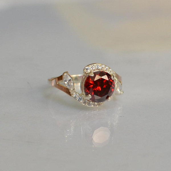 Срібна каблучка з золотими вставками