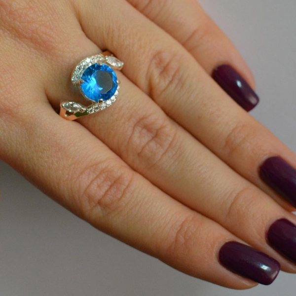 Срібна каблучка з золотими вставками