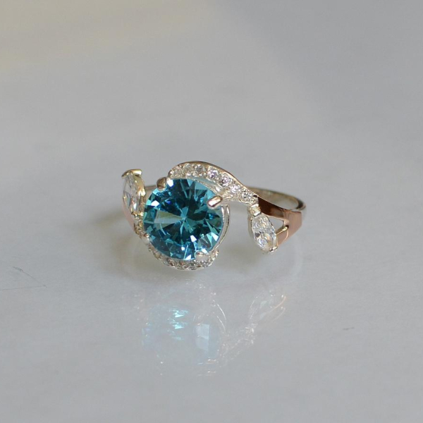 Срібна каблучка з золотими вставками