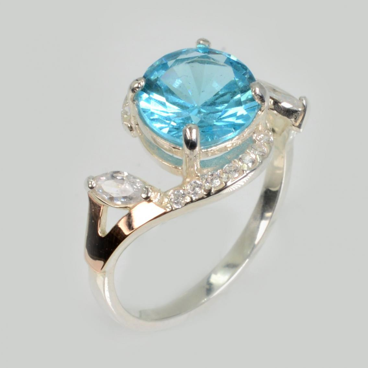 Срібна каблучка з золотими вставками