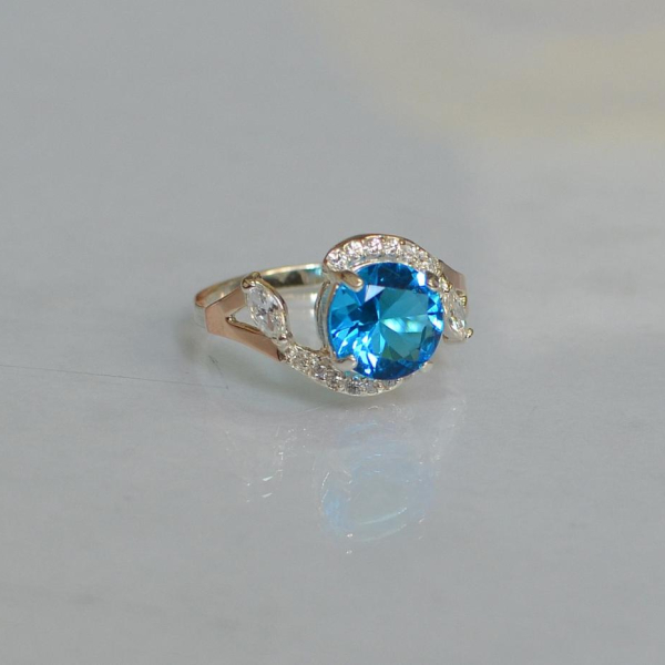 Срібна каблучка з золотими вставками