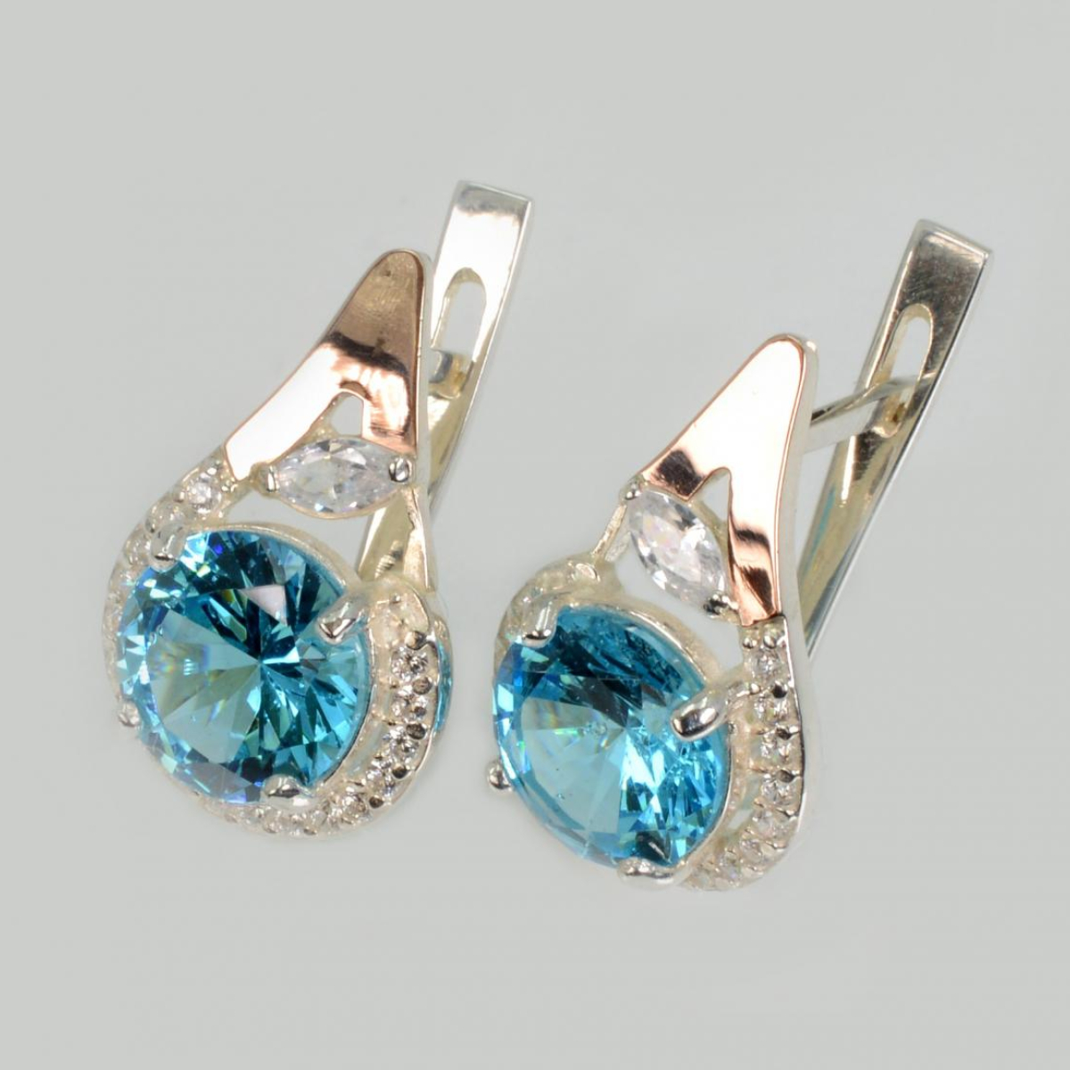 Срібні сережки з золотими вставками