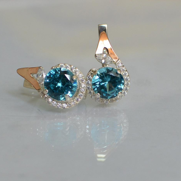 Срібні сережки з золотими вставками