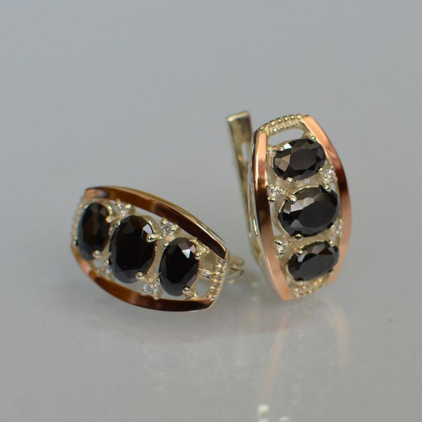 Срібні сережки з золотими вставками