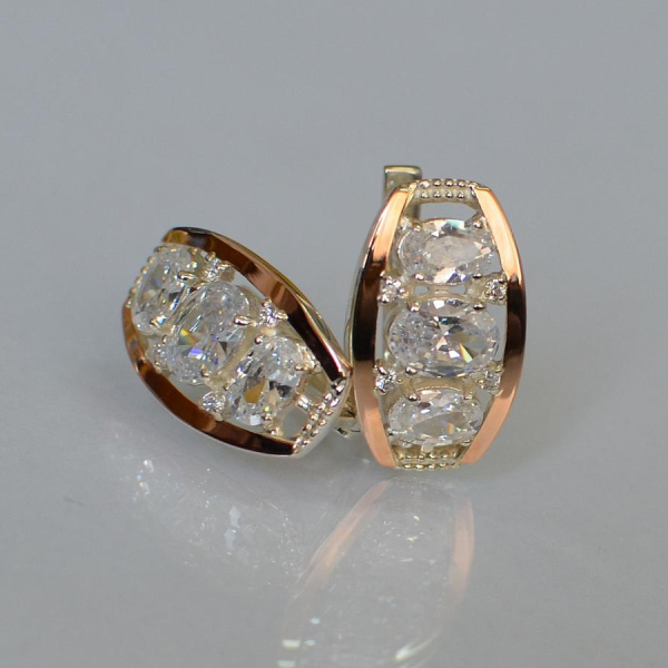 Срібні сережки з золотими вставками