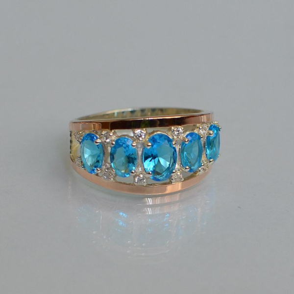 Срібна каблучка з золотими вставками