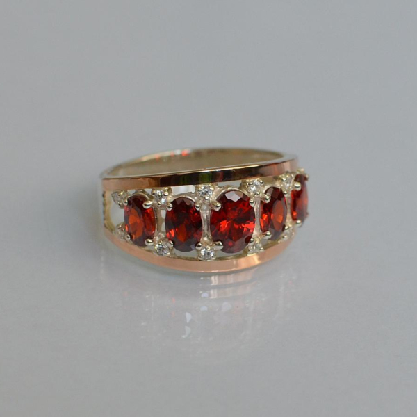 Срібна каблучка з золотими вставками