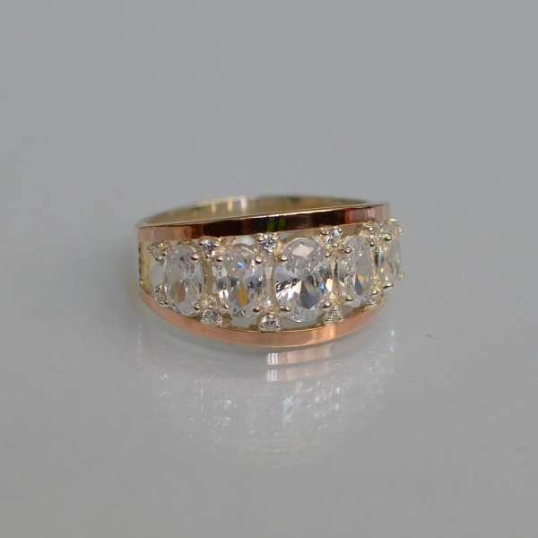 Срібна каблучка з золотими вставками