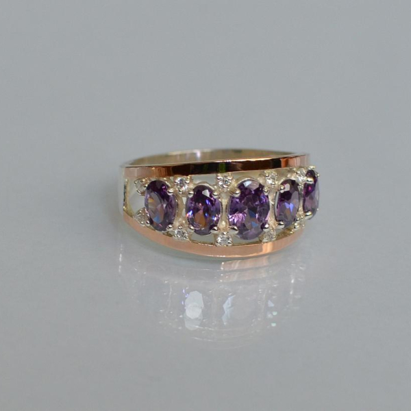 Срібна каблучка з золотими вставками