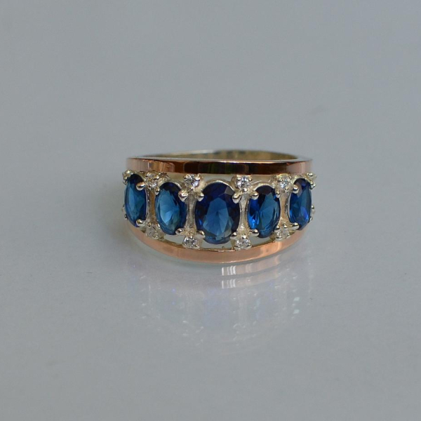 Срібна каблучка з золотими вставками