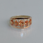 Срібна каблучка з золотими вставками