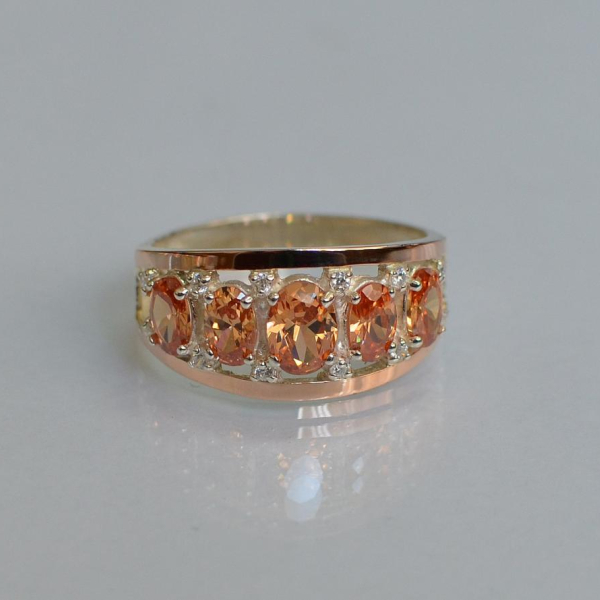 Срібна каблучка з золотими вставками