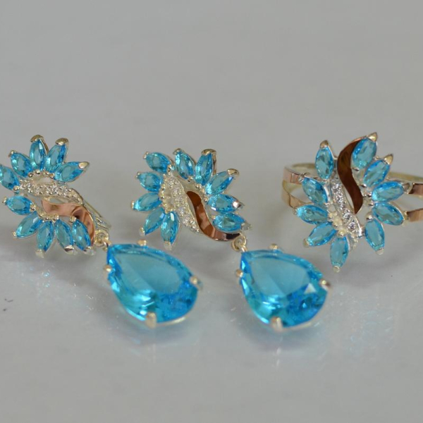 Срібний набір з золотими пластинами