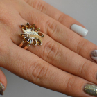 Срібна каблучка з золотими вставками