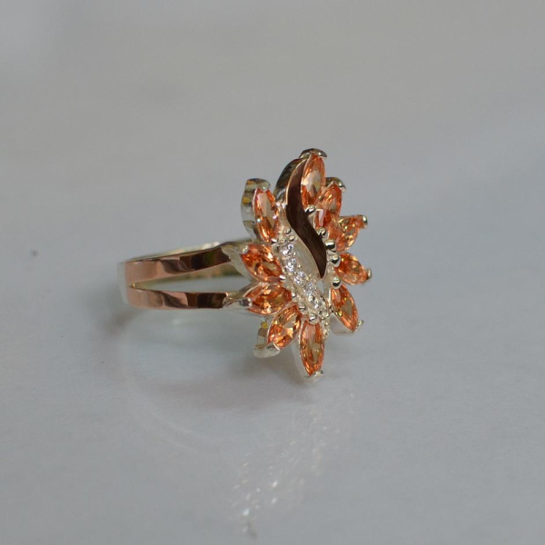 Срібна каблучка з золотими вставками