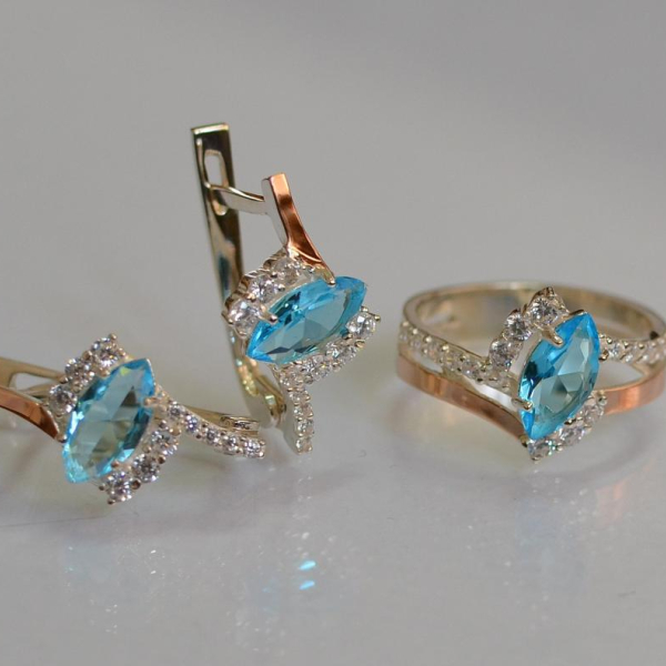 Срібний набір з золотими пластинами