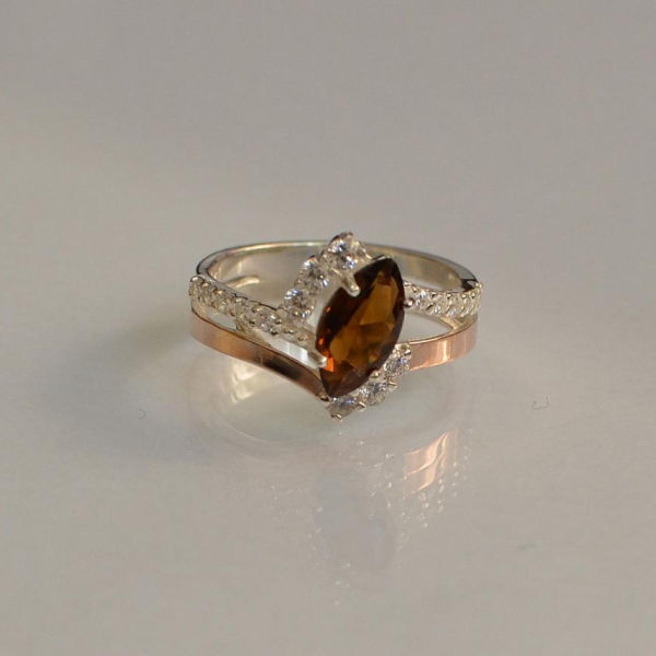 Срібна каблучка з золотими вставками