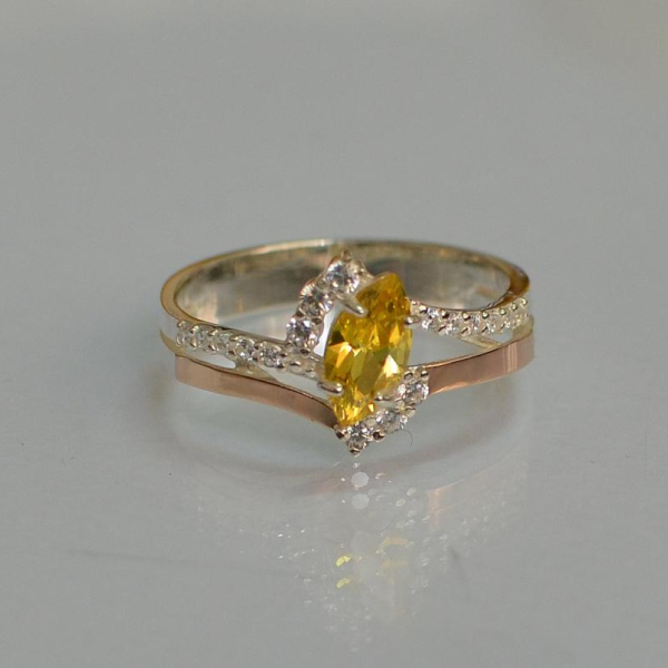 Срібна каблучка з золотими вставками