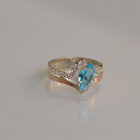 Срібна каблучка з золотими вставками