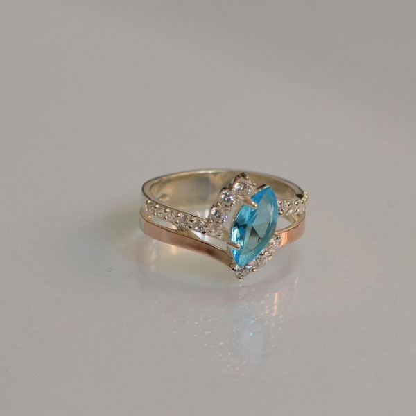 Срібна каблучка з золотими вставками