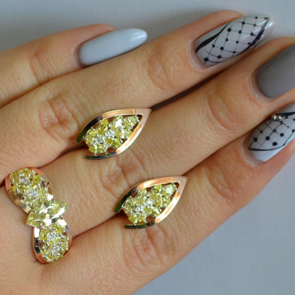 Срібний набір з золотими пластинами